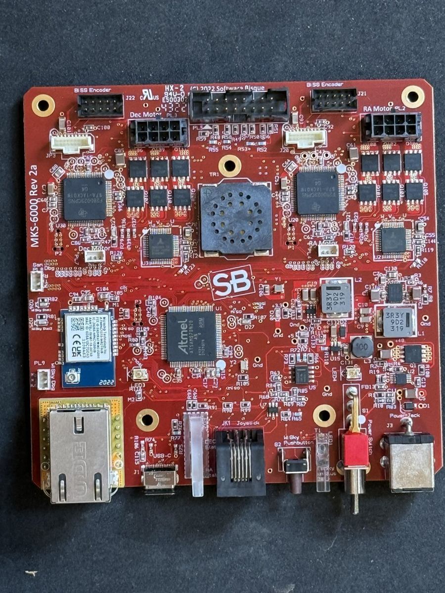 MKS-6000 Rev 2a controller: a red printed circuit board with two DSPs, motor connectors, Ethernet, and BiSS encoder headers at the top corners.